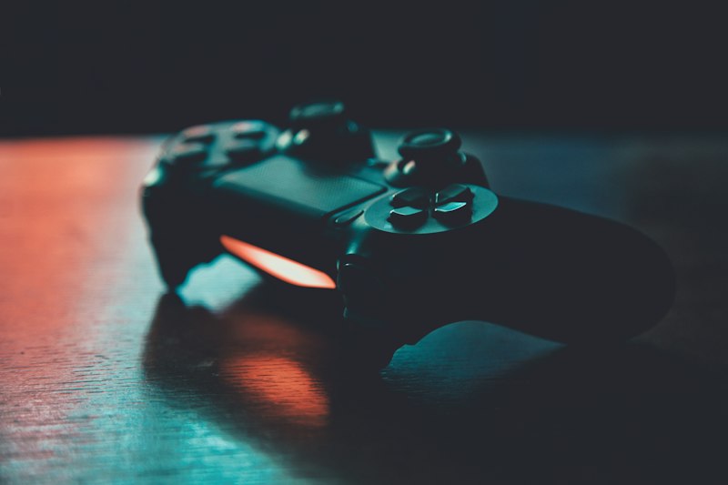 Gamer holding controller neon